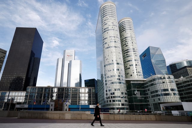A man walks on the esplanade of La Defense in the financial and business district of La Defense, near Paris, France, January 27, 2025. REUTERS/Sarah Meyssonnier/ File Photo
