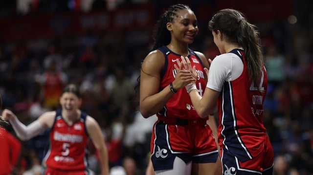 Jul 29, 2025; Washington, District of Columbia, USA; Washington Mystics guard Sonia Citron (22) celebrates its Mystics forward Kiki Iriafen (44) after scoring while being fouled against the Chicago Sky in the second half at CareFirst Arena. Mandatory Credit: Geoff Burke-Imagn Images