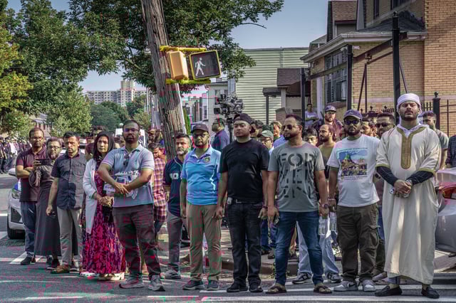 A large showing of New York City police officers and community members lined the streets outside  the Jame Masjid mosque in the Bronx to honor slain officer Didarul Islam.