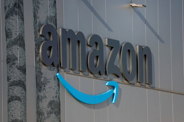 The logo of giant online retailer Amazon AMZN.O is displayed at a logistics centre in Trapagaran, Spain, December 18, 2023. REUTERS/Vincent West/File photo
