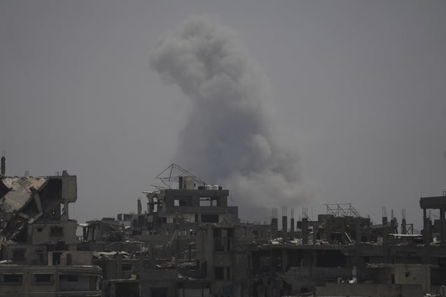 Smoke rises following an Israeli airstrike in northern Gaza Strip, Tuesday, July 29, 2025. (AP Photo/Jehad Alshrafi)
