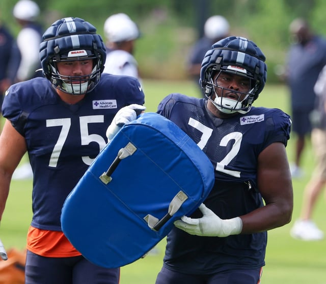 Bears offensive tackles Ozzy Trapilo (75) and Kiran Amegadjie during training camp Monday, July 28, 2025, in Lake Forest. (Stacey Wescott/Chicago Tribune)