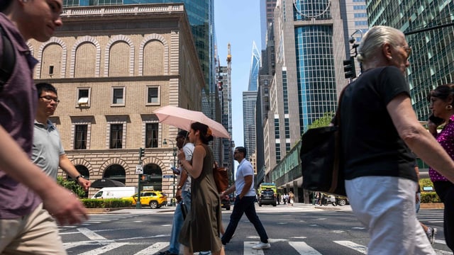 People try to stay cool on the sweltering streets of Manhattan as the region experiences another heatwave on July 29, 2025 in New York City. Temperatures are expected to reach into the high 90s with a heat index well above 100 degrees. Spencer Platt/Getty Images/AFP (Photo by SPENCER PLATT / GETTY IMAGES NORTH AMERICA / Getty Images via AFP)