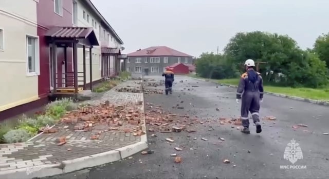 Rescuers examine a damaged building following a powerful earthquake on the island of Sakhalin, Russia, July 30, 2025, in this still image taken from video.