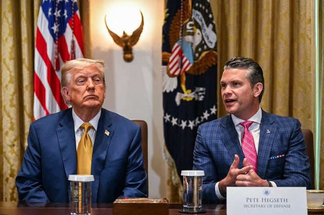 Donald Trump looks on as Secretary of Defense Pete Hegseth speaks during  a cabinet meeting in the Cabinet Room of the White House on July 8, 2025.
