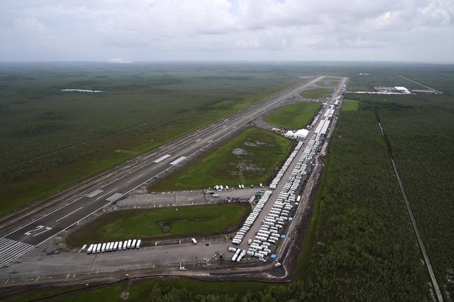 Work progresses on a new migrant detention facility dubbed "Alligator Alcatraz," at Dade-Collier Training and Transition facility in the Florida Everglades, Friday, July 4, 2025, in Ochopee, Fla. (AP Photo/Rebecca Blackwell)