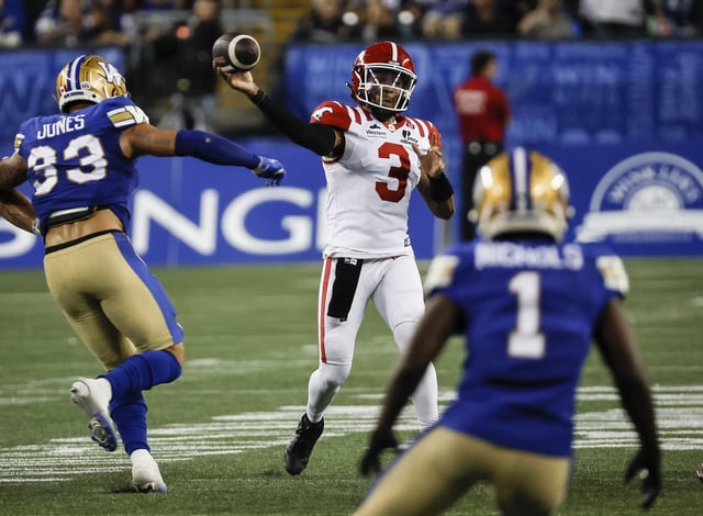 Calgary Stampeders quarterback Vernon Adams Jr. (3) throws against the Winnipeg Blue Bombers during second-half CFL action in Winnipeg Friday, July 18, 2025.   THE CANADIAN PRESS/John Woods