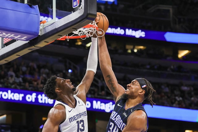 Feb 21, 2025; Orlando, Florida, USA; Memphis Grizzlies forward Jaren Jackson Jr. (13) blocks a shot by Orlando Magic center Wendell Carter Jr. (34) during the first quarter at Kia Center. Mandatory Credit: Mike Watters-Imagn Images/ File Photo