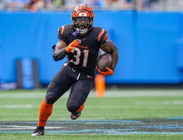 Sep 29, 2024; Charlotte, North Carolina, USA; Cincinnati Bengals running back Zack Moss (31) runs for yardage against the Carolina Panthers during the third quarter at Bank of America Stadium. Mandatory Credit: Jim Dedmon-Imagn Images/File Photo