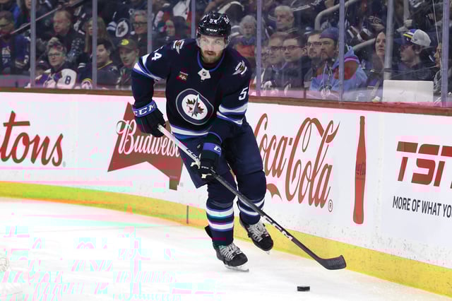 Apr 7, 2025; Winnipeg, Manitoba, CAN; Winnipeg Jets defenseman Dylan Samberg (54) skates up the ice against the St. Louis Blues in the first period at Canada Life Centre. Mandatory Credit: James Carey Lauder-Imagn Images/File Photo