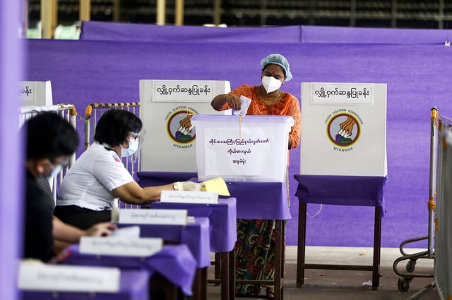 FILE - A voter casts ballot at a polling station on Nov. 8, 2020, in Yangon, Myanmar. A court in Myanmar on Sept. 2, 2022 sentenced the country's ousted leader Aung San Suu Kyi to three years' imprisonment after finding her guilty of involvement in election fraud. (AP Photo/Thein Zaw, File)