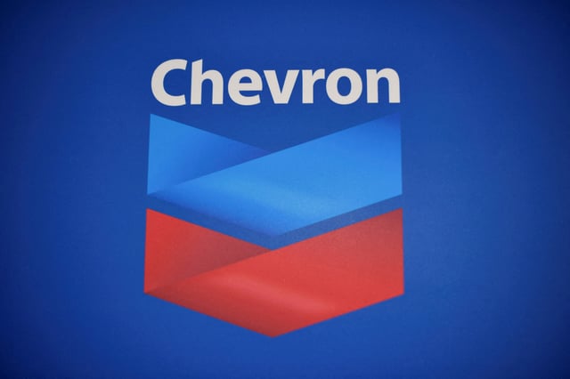 The Chevron logo is pictured after the U.S. government granted a six-month license allowing Chevron to boost oil output in U.S.-sanctioned Venezuela, in Caracas, Venezuela, December 2, 2022. REUTERS/Gaby Oraa/File Photo