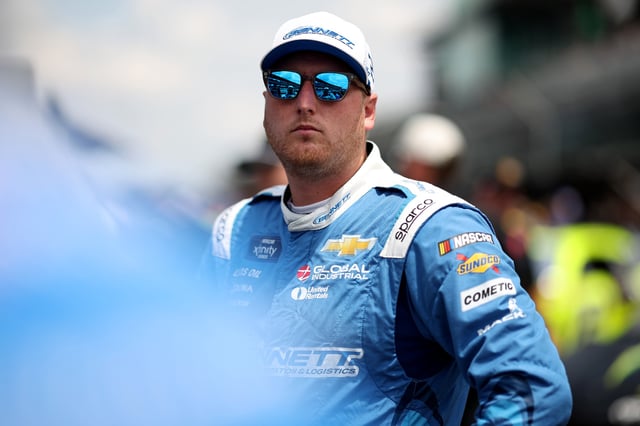 Austin Hill, driver of the #21 Bennett Transportation Chevrolet, looks on during qualifying for the NASCAR Xfinity Series Pennzoil 250 at Indianapolis Motor Speedway on July 26, 2025 in Indianapolis, Indiana.