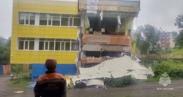 Am emergency services worker looks at a kindergarten damaged by an earthquake, in Petropavlovsk-Kamchatsky, Kamchatka Krai, Russia, July 30, 2025 in this screen grab from handout video.