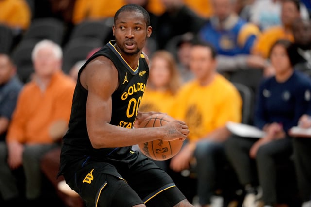 May 12, 2025; San Francisco, California, USA; Golden State Warriors forward Jonathan Kuminga (00) holds onto the ball against the Minnesota Timberwolves in the fourth quarter during game four of the second round for the 2025 NBA Playoffs at Chase Center. Mandatory Credit: Cary Edmondson-Imagn Images/File Photo