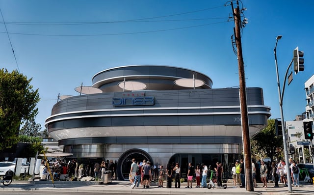 A diners line up and wait to enter the Tesla Diner, an American diner and a Tesla Supercharging station in the Hollywood section of Los Angeles on Tuesday, July 22, 2025. (AP Photo/Richard Vogel)
