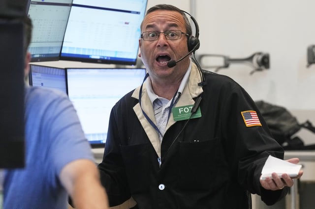 Options trader Matthew Hefner works on the floor of the New York Stock Exchange, Tuesday, July 29, 2025. (AP Photo/Richard Drew)