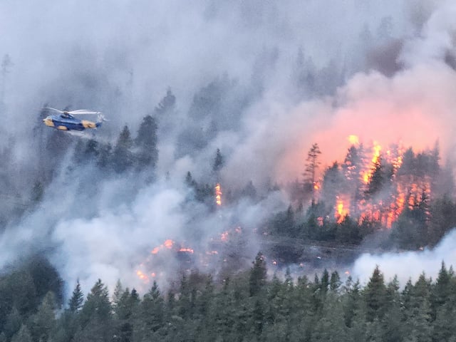 A helicopter helps battle the Cantilever Bar wildfire south of Lytton. 