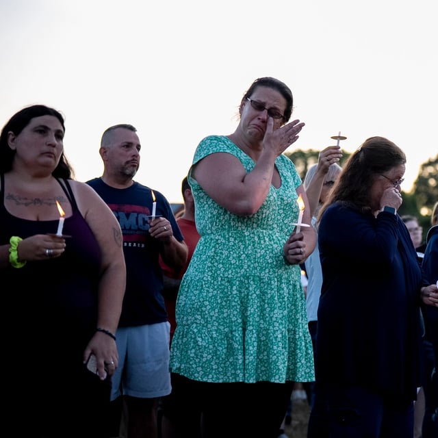 People gather at a vigil for a nine-year-old Montreal girl whose body was found in their community over the weekend, in Ticonderoga, New York on Tuesday, July 22, 2025. THE CANADIAN PRESS/Christopher Katsarov