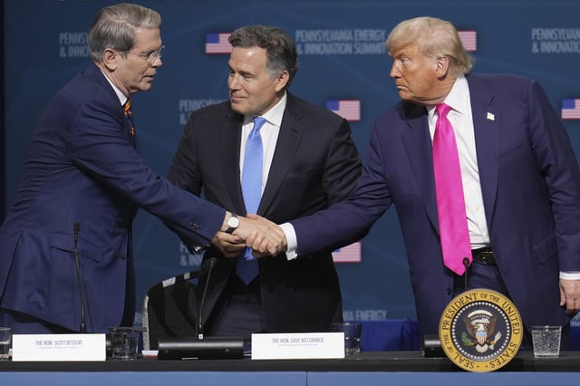 President Donald Trump, right, shakes hands with Treasury Secretary Scott Bessent, left, as Sen. Dave McCormick, R-Pa., center, looks on at the &#34;Inaugural Pennsylvania Energy and Innovation Event&#34; at Carnegie Mellon University, Tuesday, July 15, 2025, in Pittsburgh.