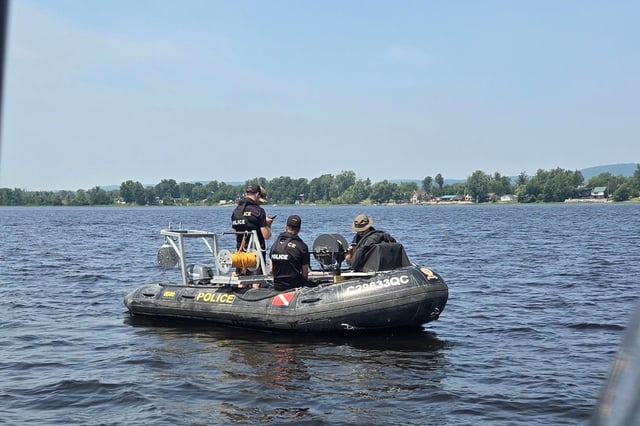 Police search for the missing man along the Ottawa River.