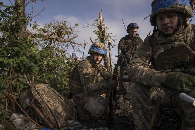A scene from Mstyslav Chernov’s Ukrainian war documentary “2000 Meters to Andriivka,” a character study of a brigade battling through about a mile of heavily fortified forest to liberate the Russian-occupied village of Andriivka in September 2023.