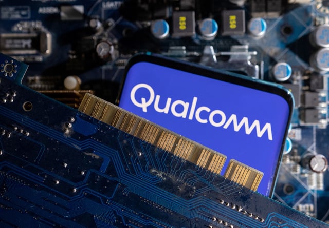 A smartphone with a displayed Qualcomm logo is placed on a computer motherboard in this illustration taken March 6, 2023. REUTERS/Dado Ruvic/Illustration/File Photo