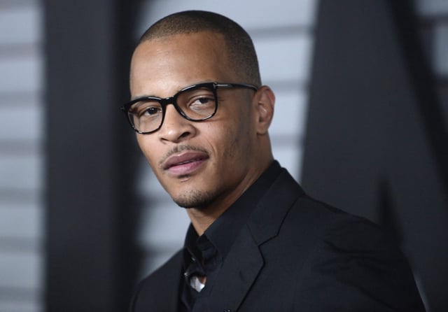 Rapper T.I. attends the Maxim Hot 100 event in West Hollywood, California June 10, 2014. REUTERS/Phil McCarten (UNITED STATES - Tags: ENTERTAINMENT)