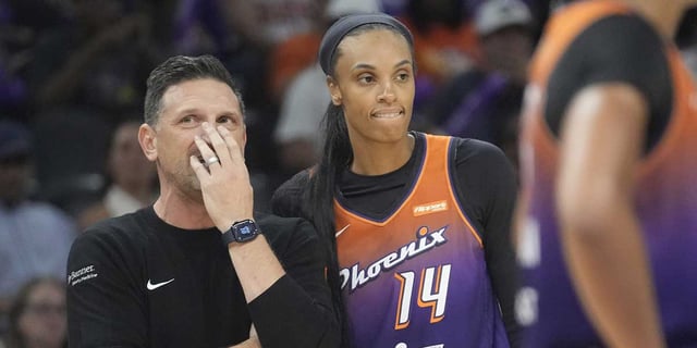 Phoenix Mercury head coach Nate Tibbetts talks with forward DeWanna Bonner (14) during the fourth quarter against the Minnesota Lynx at PHX Arena on July 9, 2025.