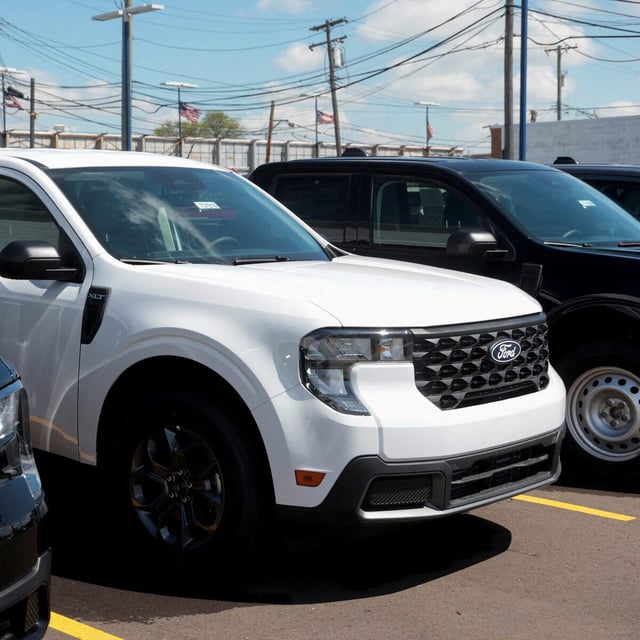 FILE PHOTO: 2025 Ford Maverick pickup trucks sit on a dealership lot for sale in Dearborn, Michigan, U.S., May 7, 2025.  REUTERS/Rebecca Cook/File Photo