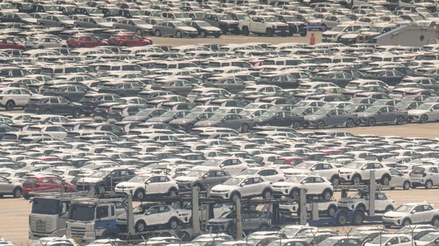 Vehicles awaiting export at a South Korean port. Photo: Anthony Wallace/AFP via Getty Images)