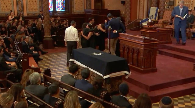 Family and friends mourn Julia Hyman during her funeral service, Central Synagogue, New York, July 30, 2025. (Screenshot from Central Synagogue livestream)