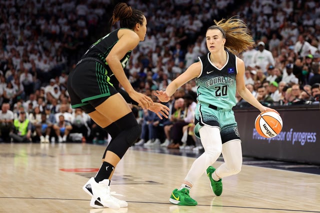 Sabrina Ionescu #20 of the New York Liberty dribbles the ball against Napheesa Collier #24 of the Minnesota Lynx in the fourth quarter during Game Three of the WNBA Finals at Target Center on October 16, 2024 in Minneapolis, Minnesota.