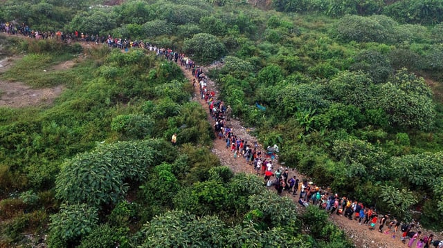 Aerial view of migrants walking by the jungle near Bajo Chiquito village of the Darién Gap in Panama in September 2023. Photo: Luis Acosta/AFP via Getty Images