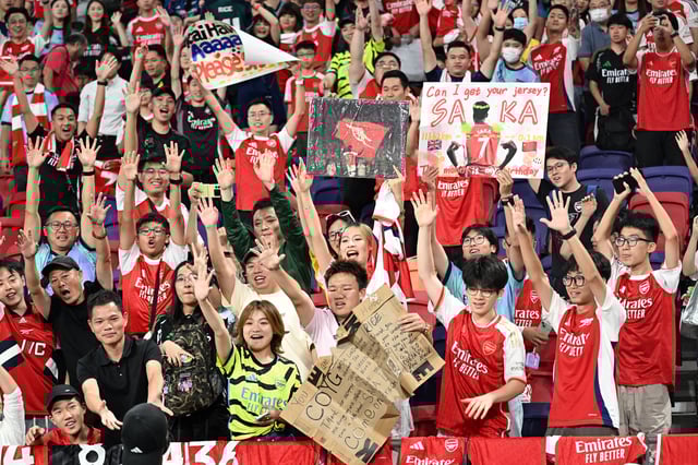 Arsenal supporters cheer on their team during a training session in Hong Kong on Wednesday.