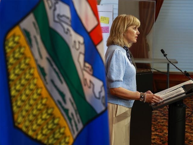 Calgary Mayor Jyoti Gondek is framed with the Alberta provincial flag as she speaks with media at City Hall following a meeting with Minister of Transportation and Economic
Corridors Devin Dreeshen on Wednesday, July 30, 2025. The two spoke about Calgary's transportation infrastructure.