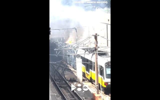 Flames shoot out of a DART train car near North Central Expressway and Ross Avenue on Wednesday afternoon.