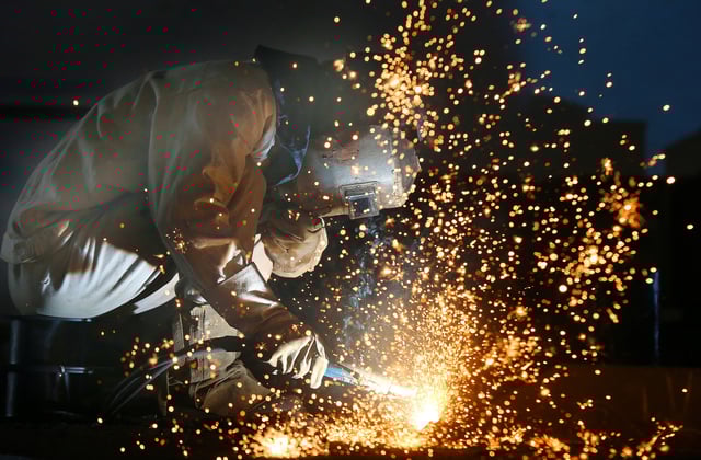 A worker works on a production line at a factory of a ship equipments manufacturer, in Nantong, Jiangsu province, China March 2, 2020. China Daily via REUTERS/ File Photo