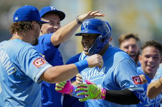 Jul 30, 2025; Kansas City, Missouri, USA; Kansas City Royals designated hitter Salvador Perez (13) celebrates with teammates after hitting a walk-off during the tenth inning against the Atlanta Braves at Kauffman Stadium. Mandatory Credit: Jay Biggerstaff-Imagn Images