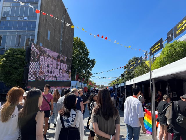 Students walk past stalls during the orientation week at The University of Sydney, in Camperdown, Australia February 15, 2023. REUTERS/ Stella Qiu/File Photo