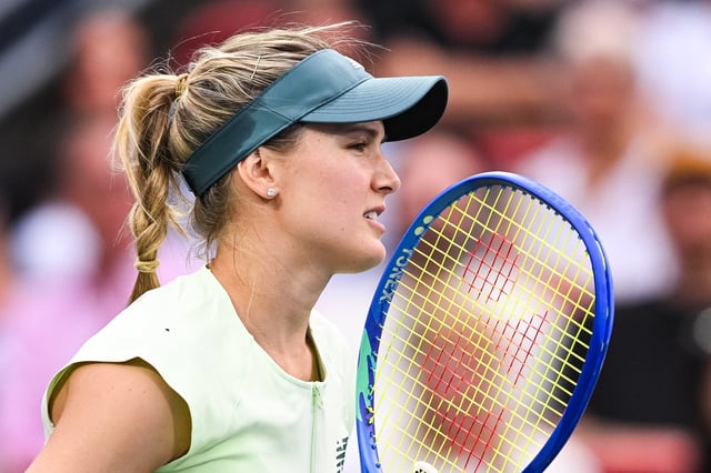 Jul 30, 2025; Montreal, QC, Canada; Eugenie Bouchard (CAN) waits for Belinda Bencic (SUI) to serve the ball in second round play at IGA Stadium. Mandatory Credit: David Kirouac-Imagn Images