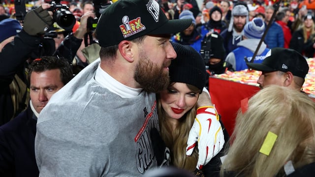 Jan 26, 2025; Kansas City, MO, USA; Recording artist Taylor Swift and Kansas City Chiefs tight end Travis Kelce (87) react after the AFC Championship game against the Buffalo Bills at GEHA Field at Arrowhead Stadium. Mandatory Credit: Mark J. Rebilas-Imagn Images.