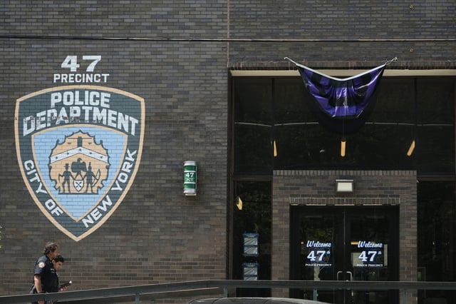 New York Police officers arrive at the NYPD 47th Precinct where NYPD officer Didarul Islam, who was killed Monday, served, in the Bronx borough of New York, Tuesday, July 29, 2025. (AP Photo/Seth Wenig)