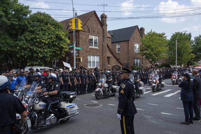 NYPD officers on motorcycle escorting an ambulance carrying a casket of NYPD Officer Didarul Islam arrive at Parkchester Jame Masjid after Monday's deadly shooting, Tuesday, July 29, 2025, in New York. (AP Photo/Yuki Iwamura)