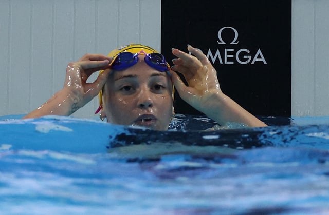 Swimming - World Aquatics Championships - Women 200m Freestyle - Finals - World Aquatics Championships Arena, Singapore - July 30, 2025 Australia's Mollie O'Callaghan after winning the final REUTERS/Edgar Su