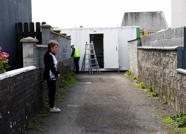 Historian Catherine Corless visits the excavation site of St Mary's home for unmarried mothers and their children, in Tuam, Ireland, July 7, 2025. (AP Photo/Peter Morrison)