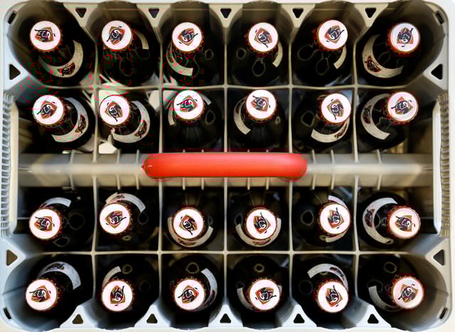 A rack of non-alcoholic Jupiler beer bottles is seen at the headquarters of Anheuser-Busch InBev in Leuven, Belgium March 1, 2018. REUTERS/Francois Lenoir/ File Photo