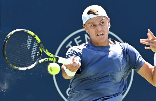 Jul 29, 2025; Toronto, ON, Canada;  Holger Rune (DEN) plays a shot against Giovanni Mpetshi Perricard (FRA) during second round play at Sobeys Stadium. Mandatory Credit: Dan Hamilton-Imagn Images/File Photo