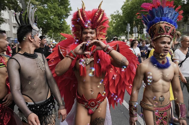People attend the LGBTQ annual pride march in Berlin, Germany, Saturday, July 26, 2025. (AP Photo/Ebrahim Noroozi)