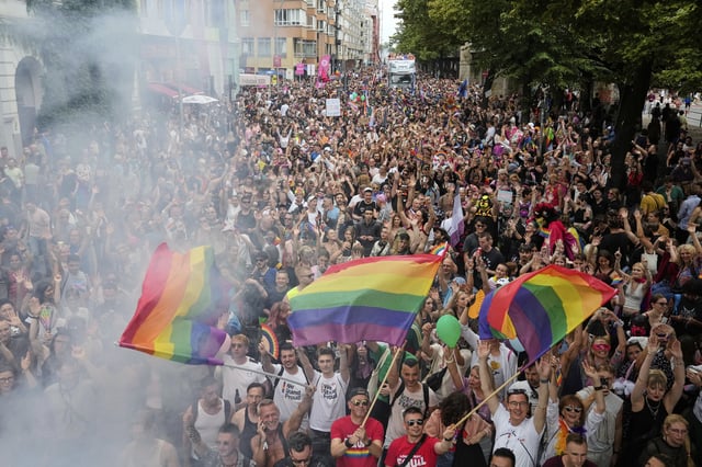 People dance as they take part in the LGBTQ annual pride march in Berlin, Germany, Saturday, July 26, 2025. (AP Photo/Ebrahim Noroozi)